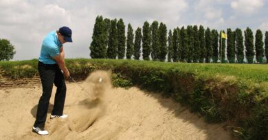 Golfspelare i bunker